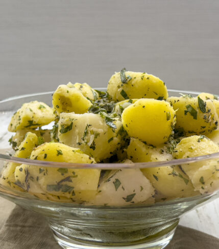 A delicious bowl of Mediterranean potato salad with fresh herbs and lemon dressing