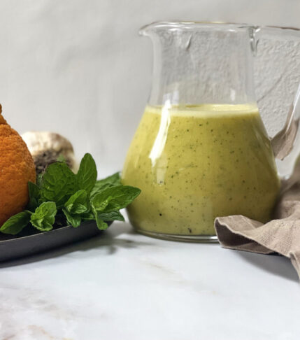 A jar of homemade Mandarin Vinaigrette salad dressing.