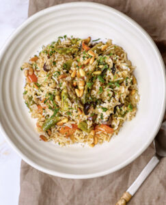 A vegetarian Mediterranean-inspired rice bowl with za'atar, feta, and fresh veggies.