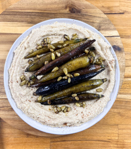 Glazed Carrots Over Creamy Hummus: A Delectable Fusion of Flavors