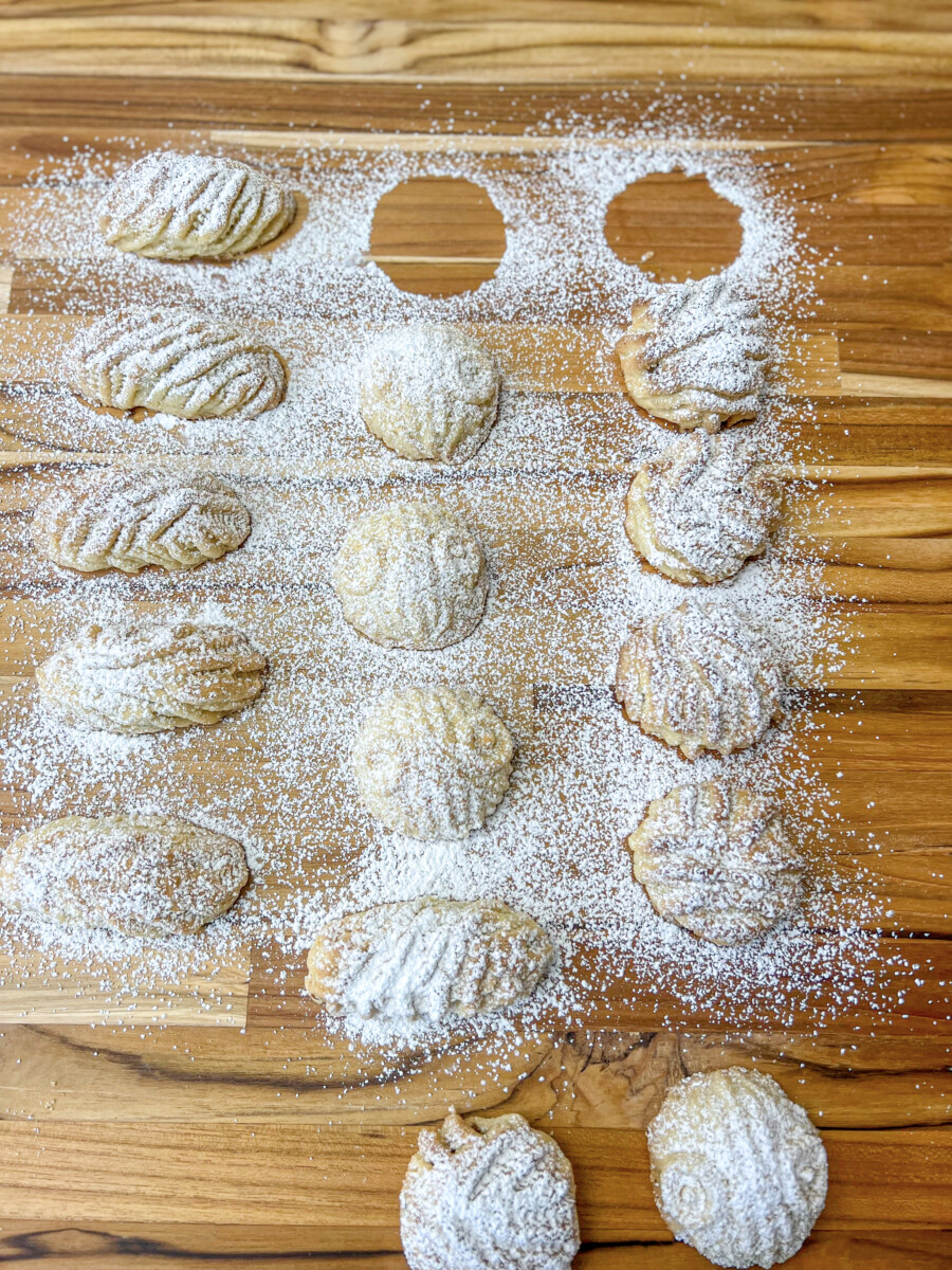 Assortment of homemade Middle Eastern Maamoul cookies with various fillings, including date, pistachio, and walnut.