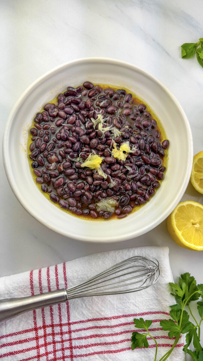 Delicious pomegranate molasses dressing and beans soaking in preparation for a flavorful mea