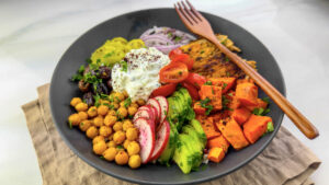 A delicious Mediterranean chicken over rice bowl with tzatziki sauce.
