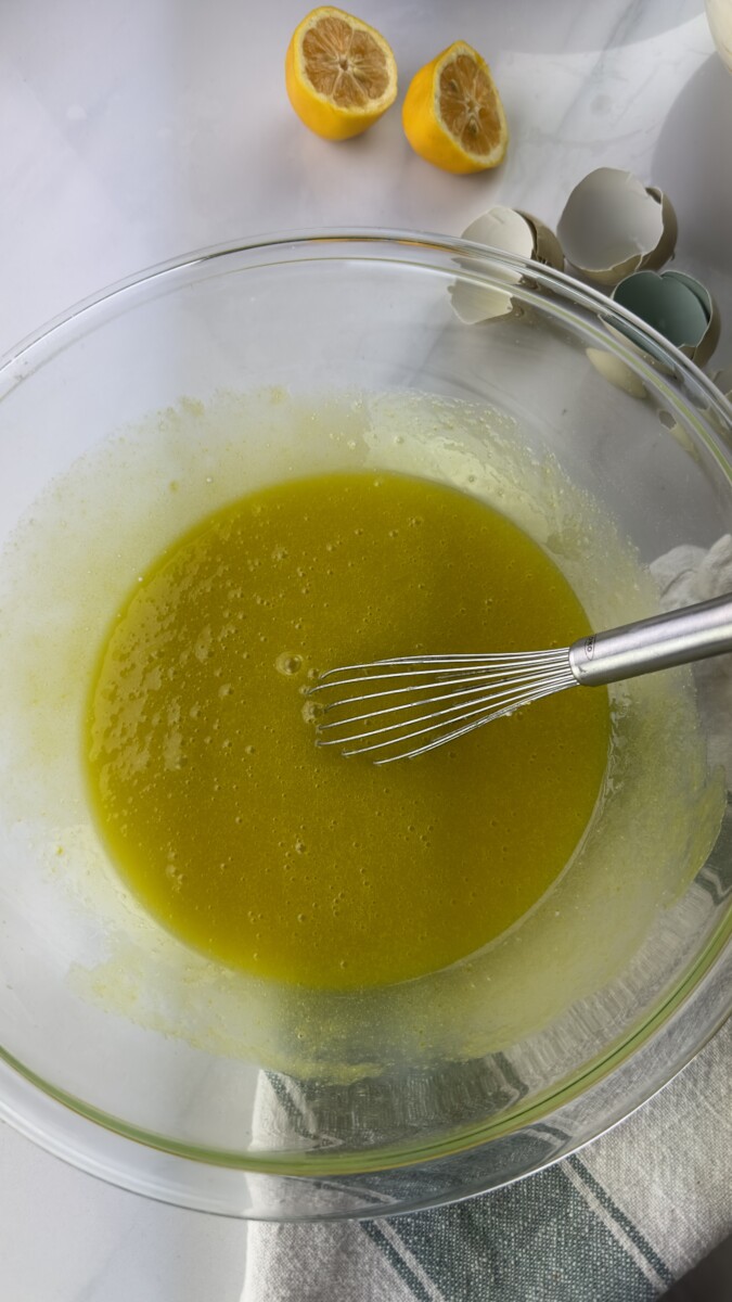 Whisking Olive Oil, Sugar, Eggs, and Cream Fraiche in a Bowl"