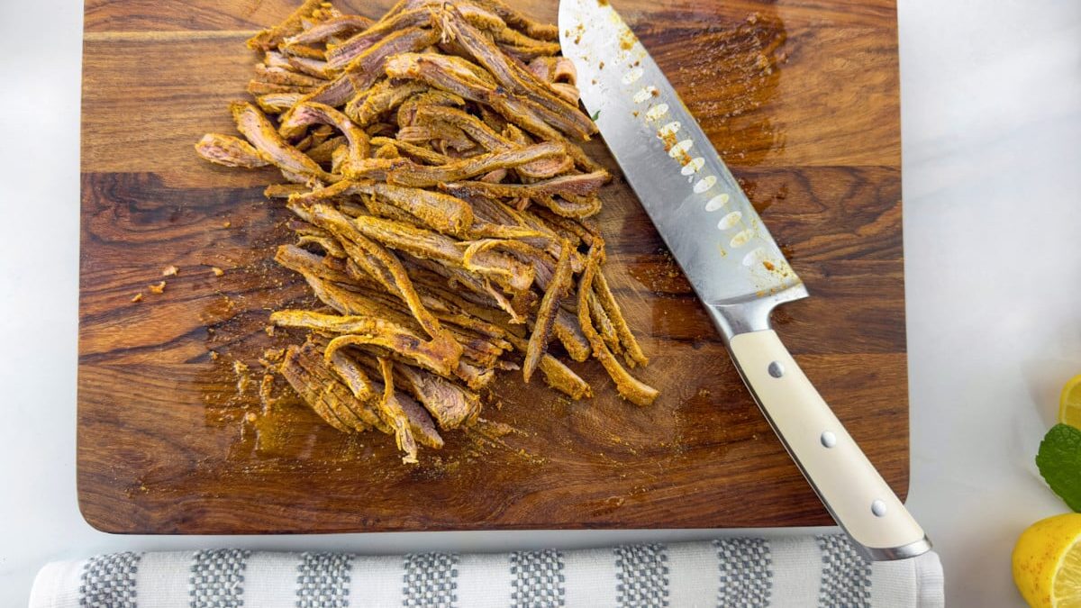 Juicy Sliced Lamb: A Mouthwatering Delight on the Cutting Board