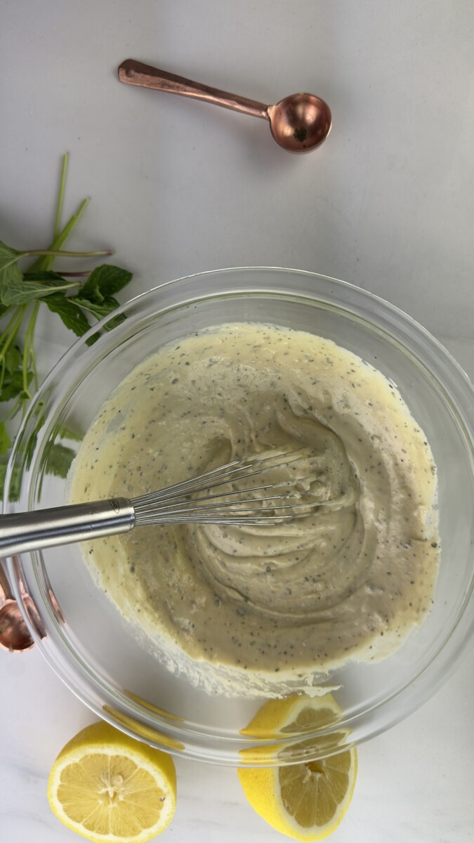 Creamy Tahini Dressing Being Whisked