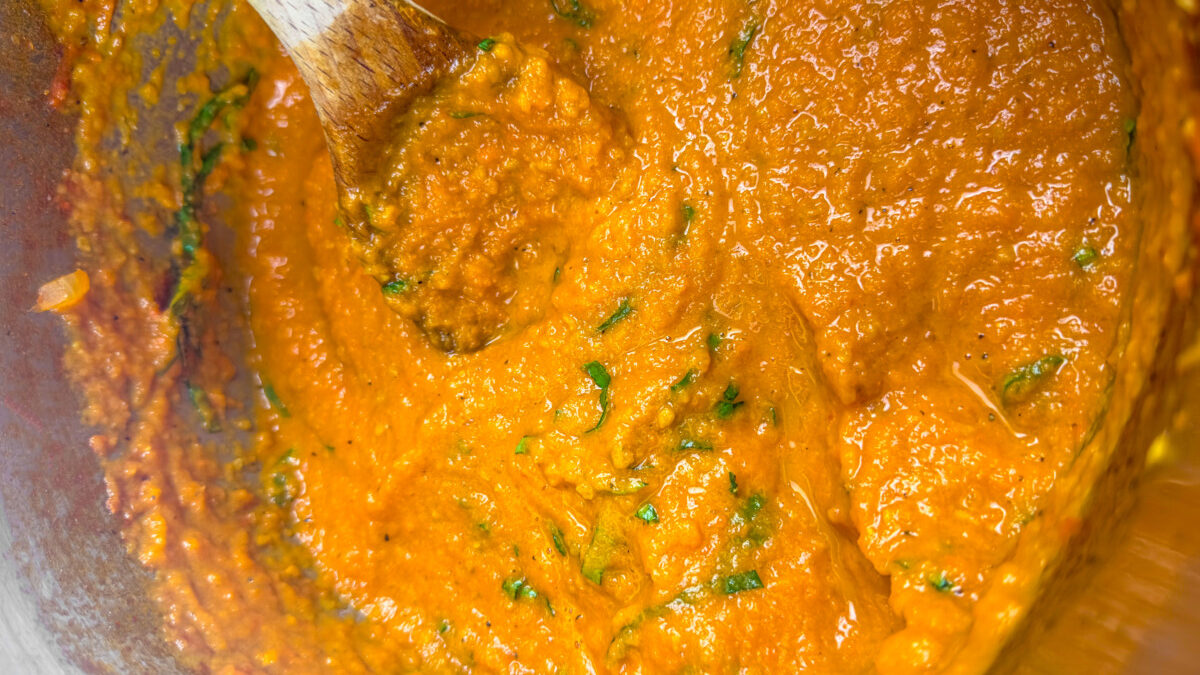 Seasoning the Romesco Sauce with Fresh Basil, Salt, and Pepper