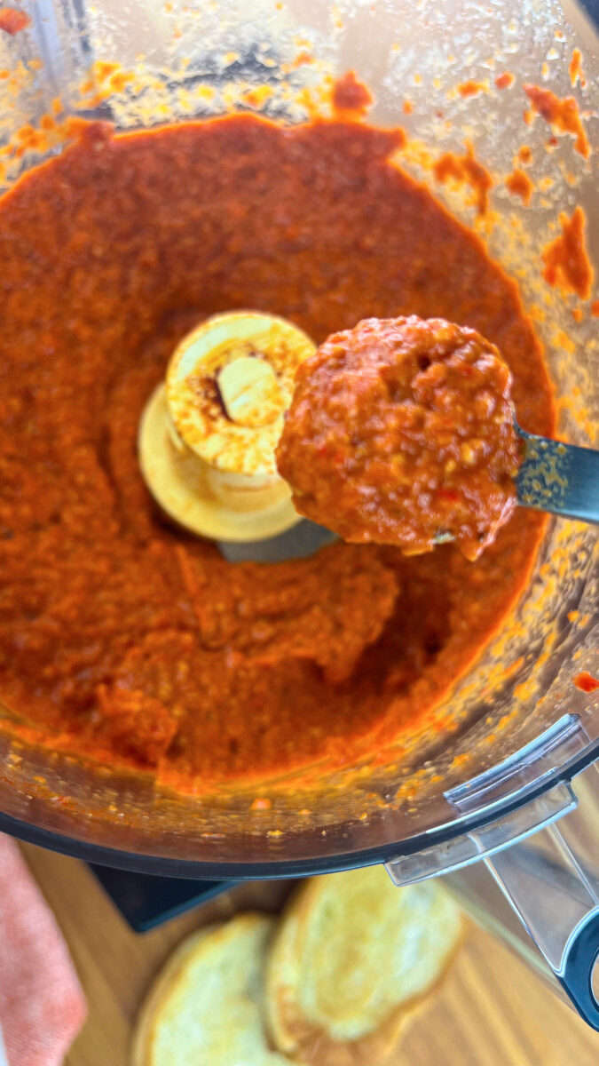 Smoothly processed Romesco dip showcasing its rich texture and thickness.