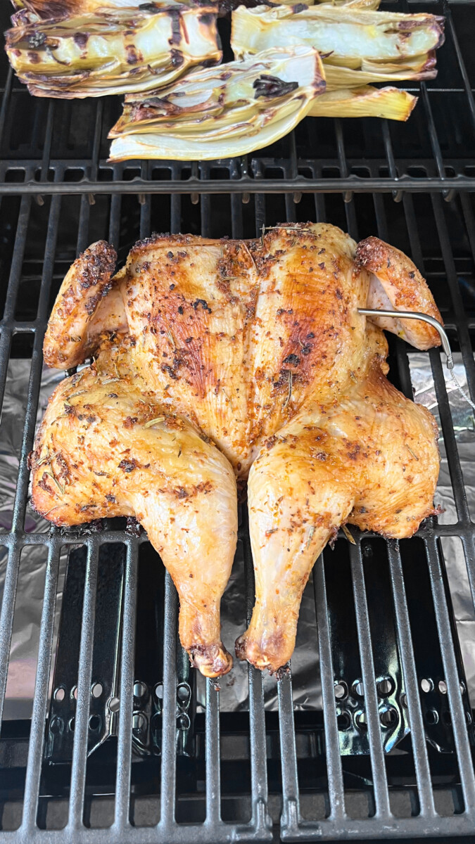 Golden-brown roasted chicken on the BBQ, after 45 to 55 minutes of grilling perfection.