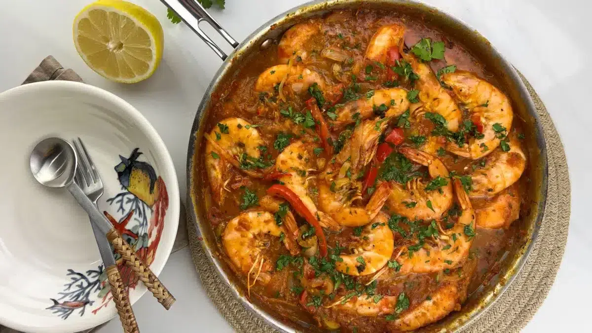 A plate of Mediterranean shrimp cooked in harissa sauce.