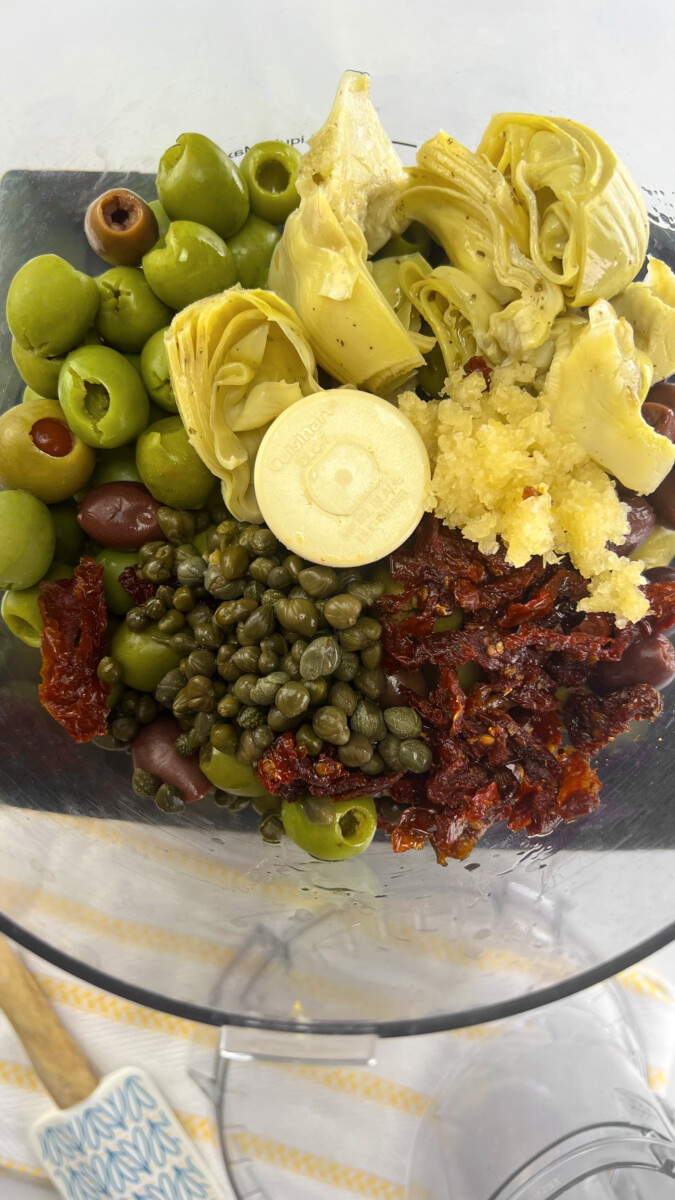 Artichoke Hearts, Capers, and Sun-Dried Tomatoes Added to Olives for Tapenade”