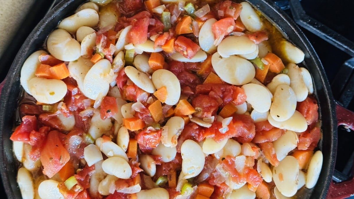 Tender Greek lima beans meet water, prepping for the oven's embrace in Baked Greek Beans.