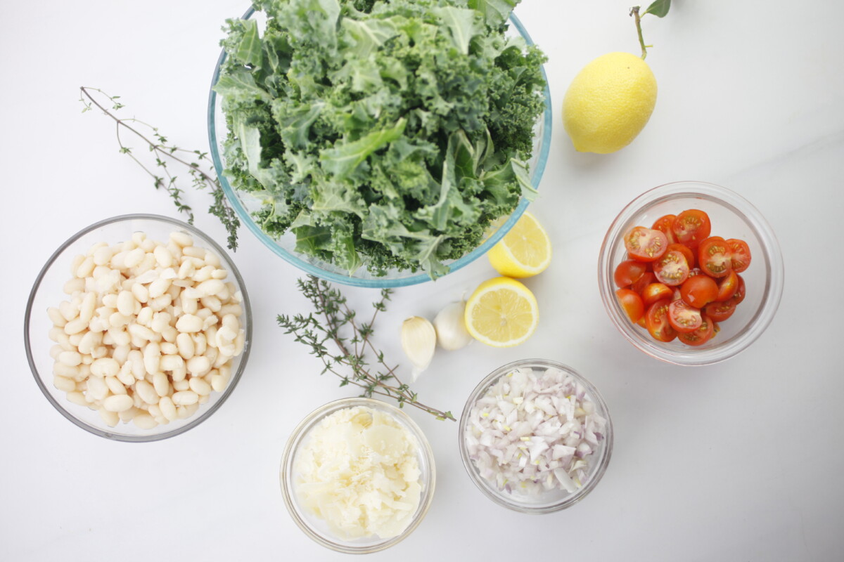 Fresh ingredients neatly arranged and measured for the Italian-Style White Bean and Kale Medley recipe