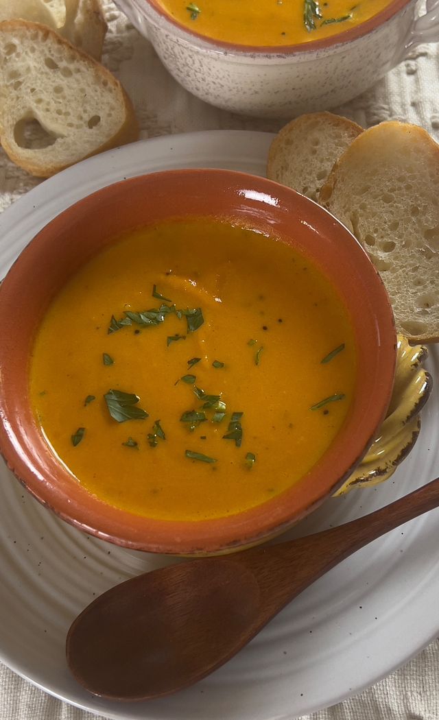 A creamy, vegan-friendly soup that blends the natural sweetness of carrots with the rich, tropical flavor of coconut milk for a vibrant, satisfying meal.