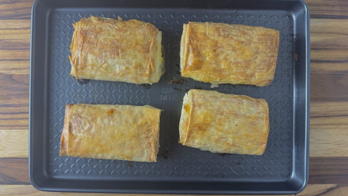 Crispy golden phyllo-wrapped feta fresh out of the oven after baking for 25 minutes.