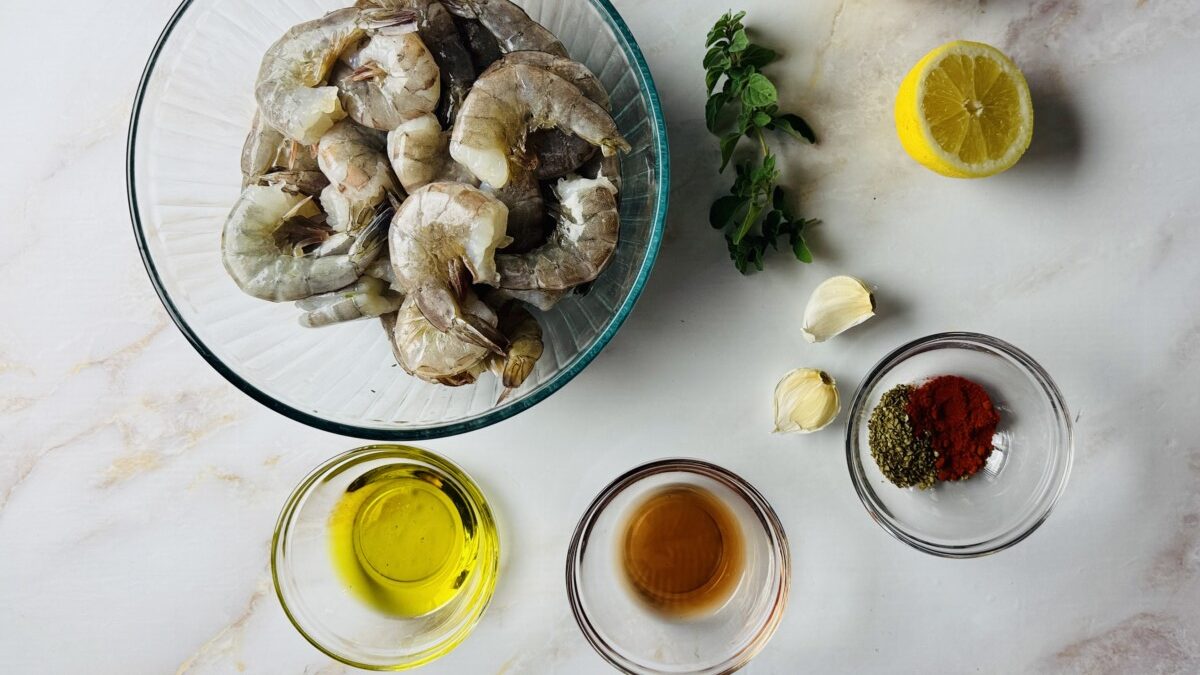 A vibrant assortment of fresh ingredients for Greek marinade and grilled skewers.