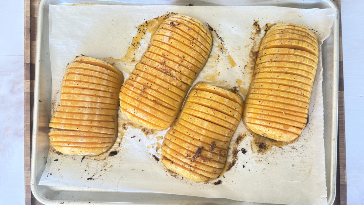 Golden roasted hasselback butternut squash with crispy edges fresh from the oven