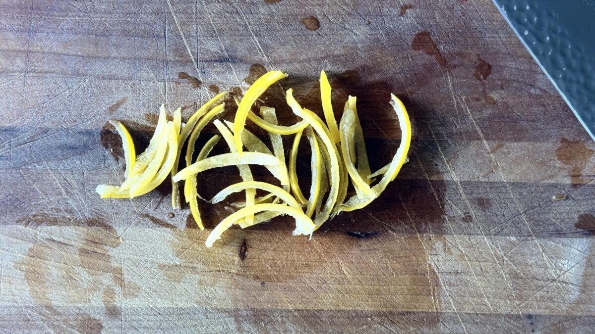 Preserved lemon skin sliced into thin ribbons for harissa roasted carrots recipe